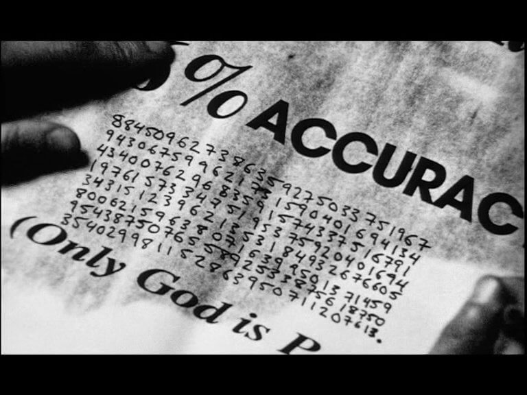Max writes down the 216-digit number on a newspaper page with the message "Only God is Perfect"
