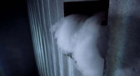 White vapour coming out of a hole in the wall