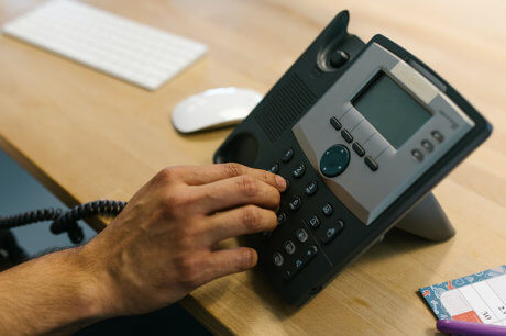 Dialing a phone number on the telephone